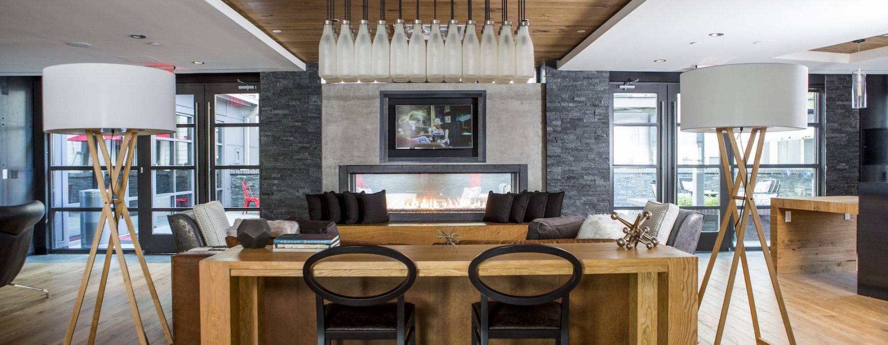 a spacious lounge with a fireplace