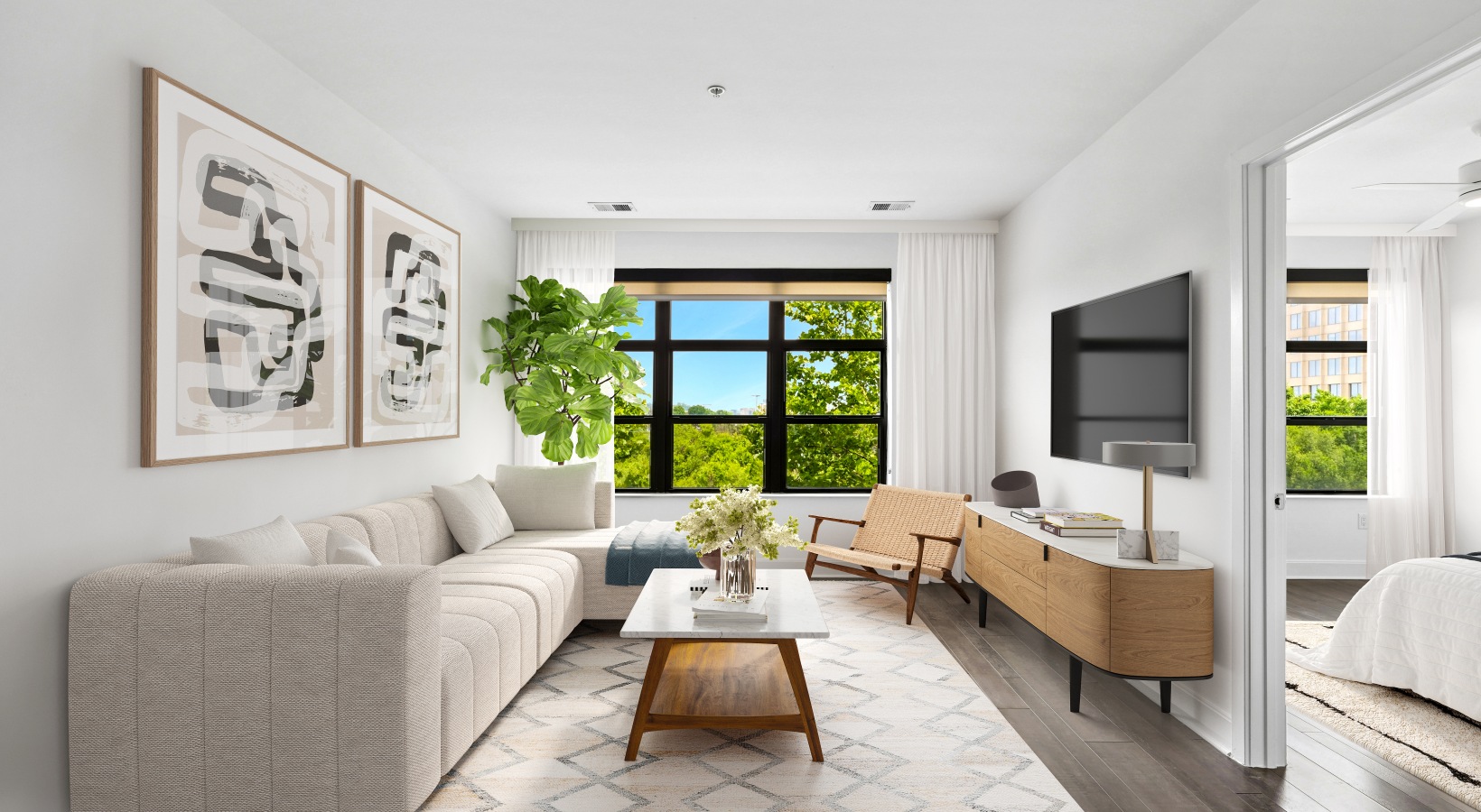 Living room with couch and tv and large window