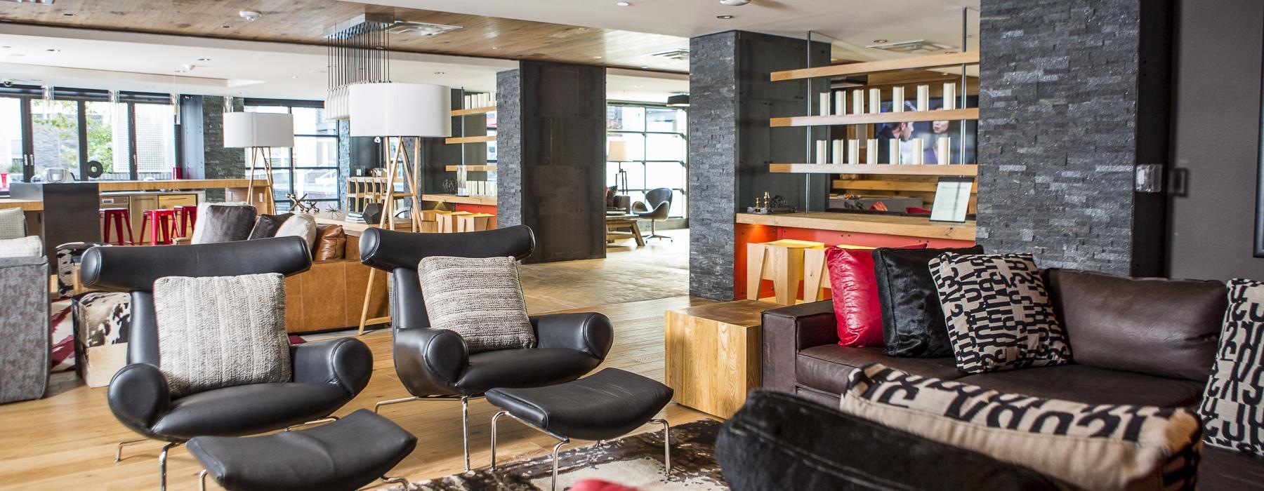 a spacious room with a couch and chairs